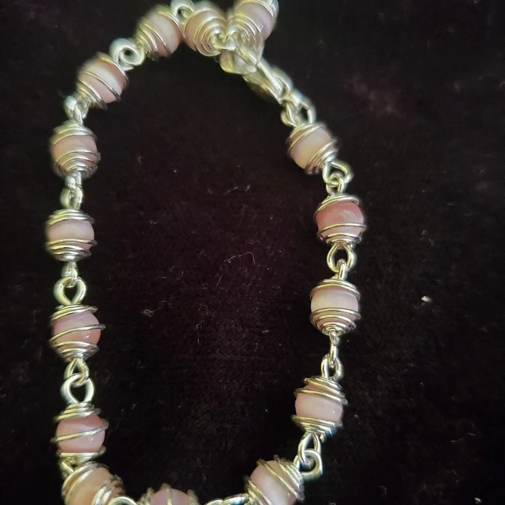 Two silver with pink pearl stones